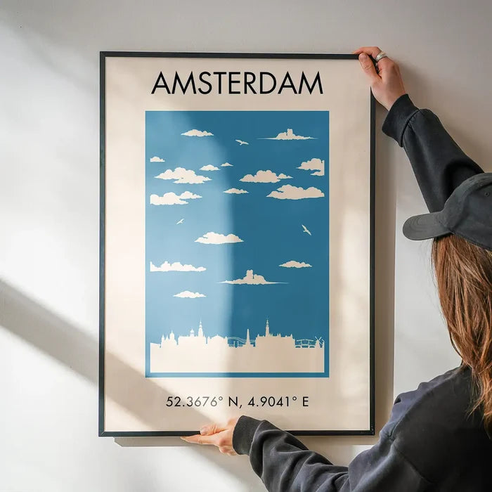 Amsterdam Tourist Style Print being hung on a wall in a black frame