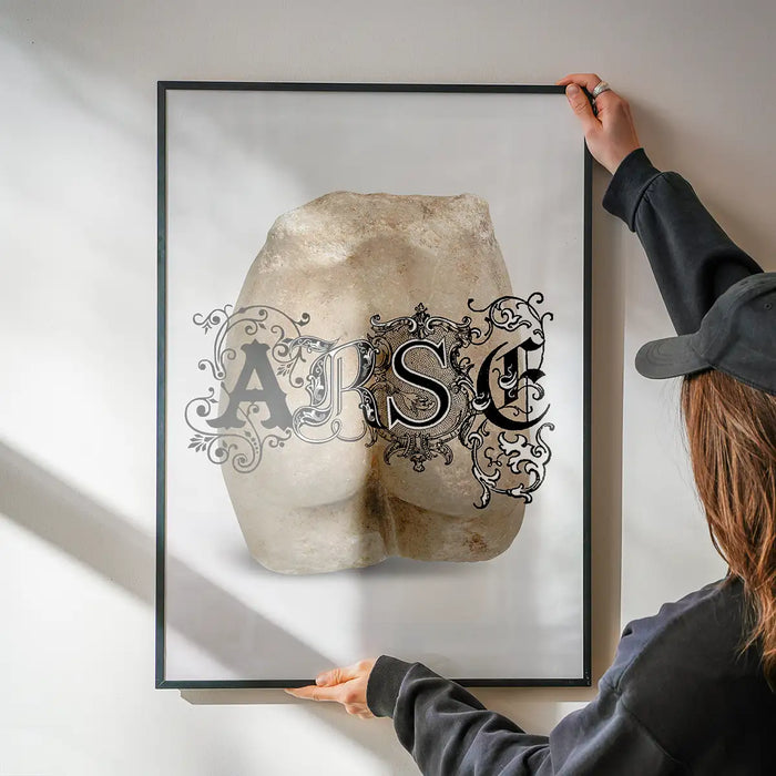 Arse Sculpture Print being hung on a wall in a black frame
