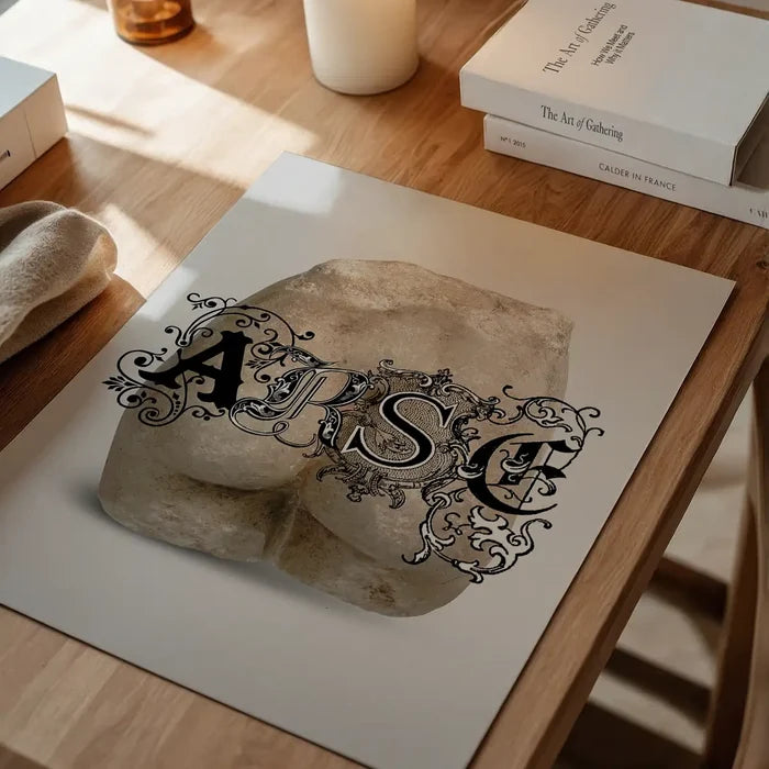 Arse Sculpture Print, quirky altered art print unframed on a home office desk