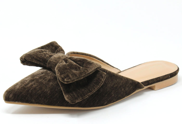 Brown velvet pointed flat shoe on a while background. With bow detail