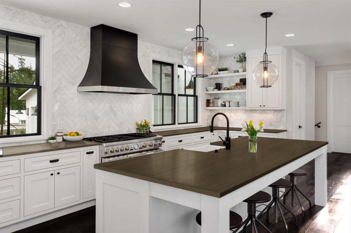 Retique It charcoal stain kit applied to a kitchen island countertop with a textured, grained finish.
