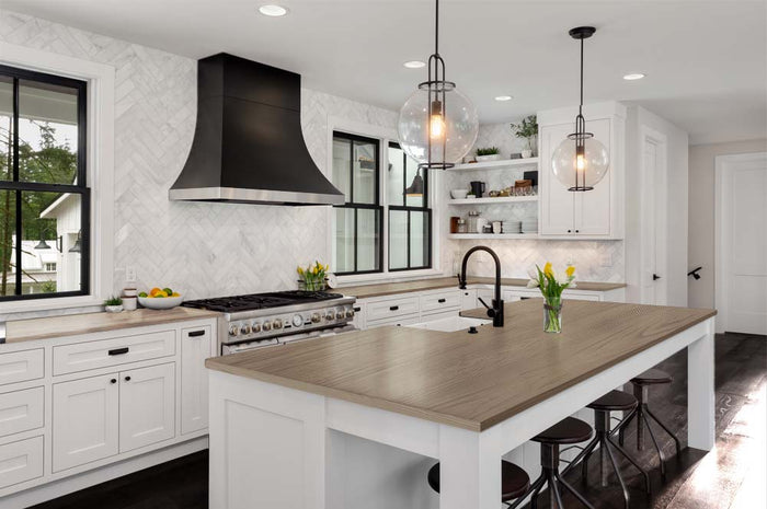 Weathered wood kitchen countertop with Retique It stain kit, showcasing textured, weathered wood grain for a rustic kitchen island.