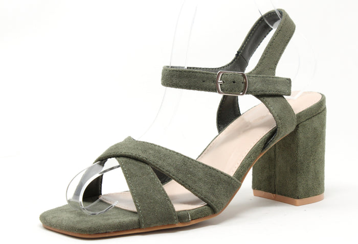 Green sandal with block heel on a white background