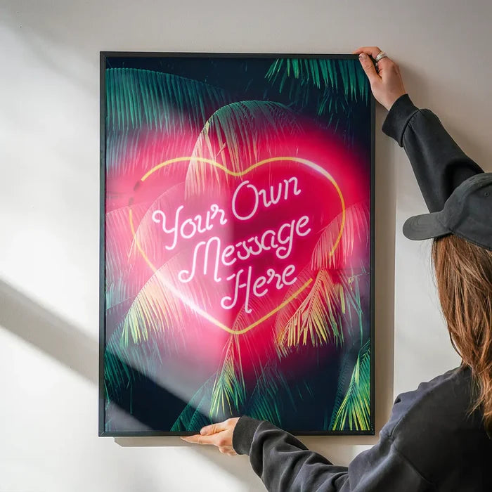 Custom Neon Love Heart Palm Trees print being hung on a wall in a black frame