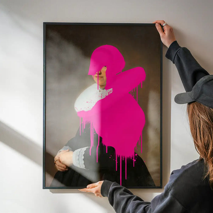 Drippy Adriana Portrait Print being hung on a wall in a black frame