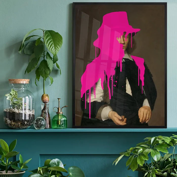 Drippy Dirck Portrait Print, quirky altered art print black framed on a living room shelf