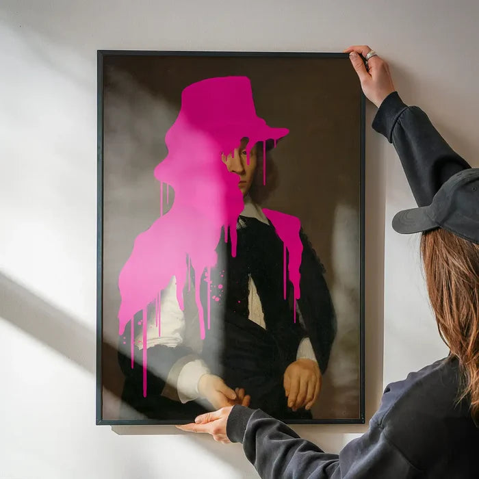 Drippy Dirck Portrait Print being hung on a wall in a black frame