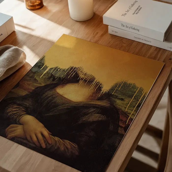 Drippy Mona Lisa Gold Graffiti Print, quirky altered art print unframed on a home office desk