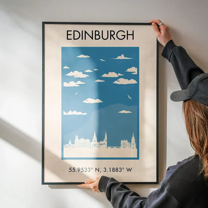 Edinburgh Tourist Style Print being hung on a wall in a black frame