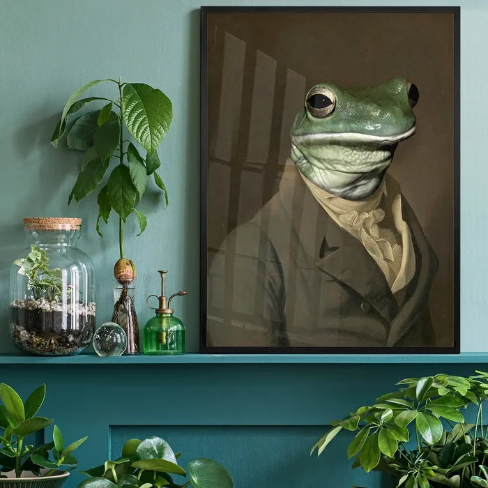 Frog Head Portrait Print, quirky altered art print black framed on a living room shelf