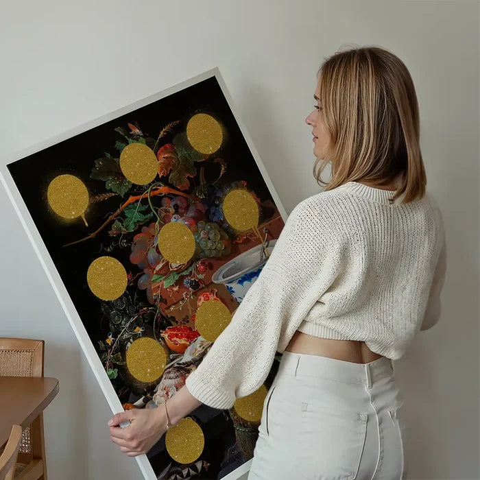 Gold Glitter Dots Still Life Print held up against a living room wall