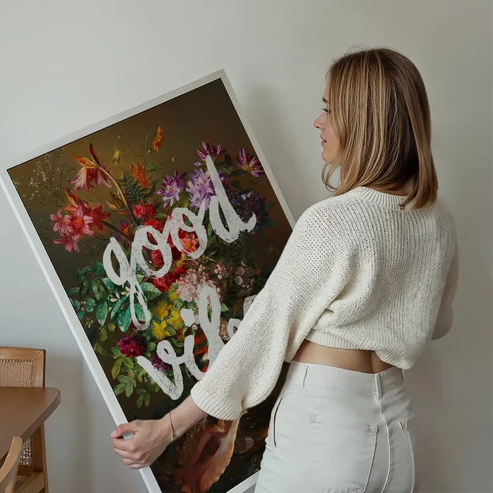 Good Vibes Floral Painting Altered Art Print held up against a living room wall
