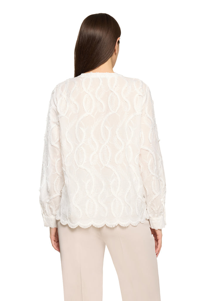 Lace blouse with decorative hem