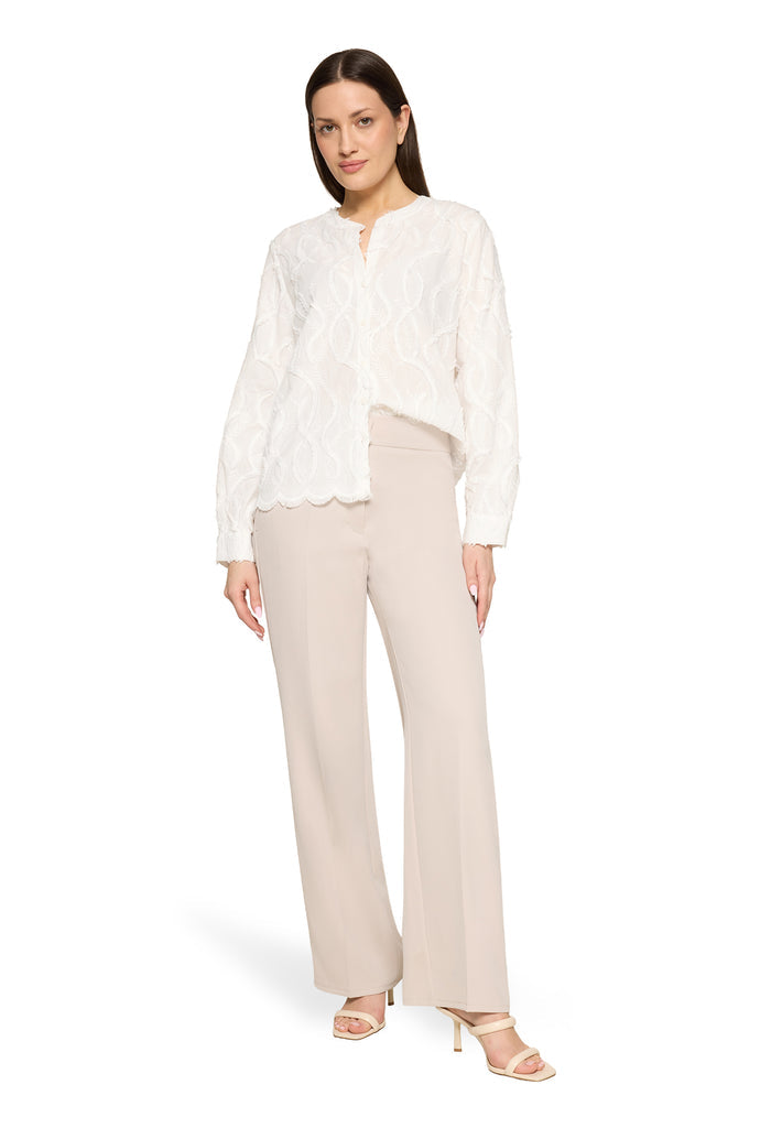 Lace blouse with decorative hem