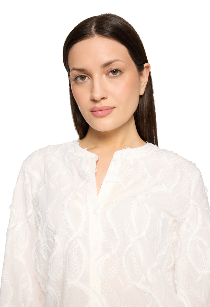 Lace blouse with decorative hem