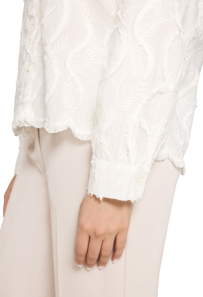 Lace blouse with decorative hem