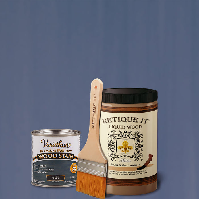 Retique It Liquid Wood Kit with Worn Navy oil-based stain, showing a brush applying the stain on wood surface.