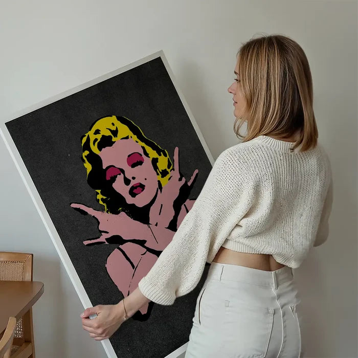 Marilyn Monroe Rock N Roll Stencil Art Graffiti Black Print held up against a living room wall