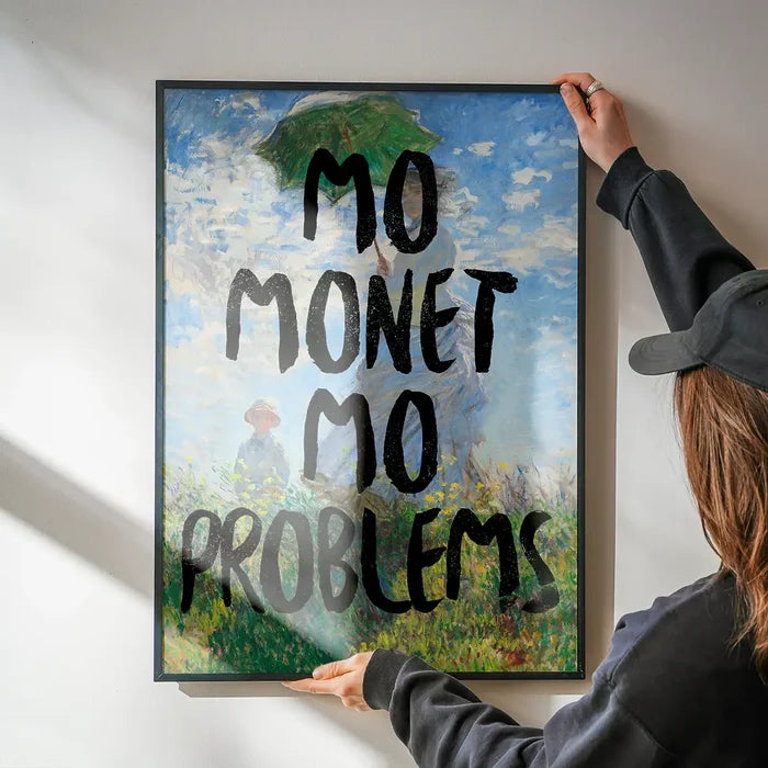 Mo Monet Mo Problems Altered Art Print being hung on a wall in a black frame