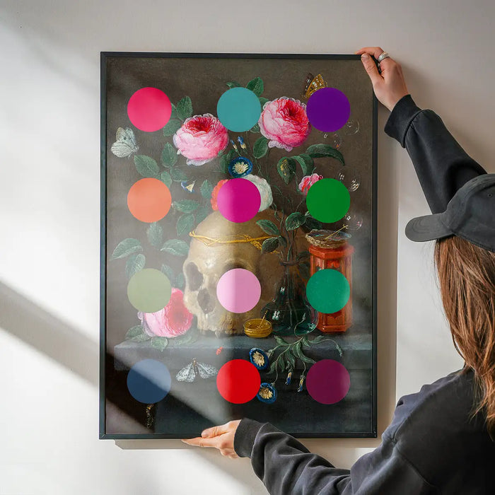 Modern Art Dots Still Life Skull and Flowers Altered Art Print being hung on a wall in a black frame