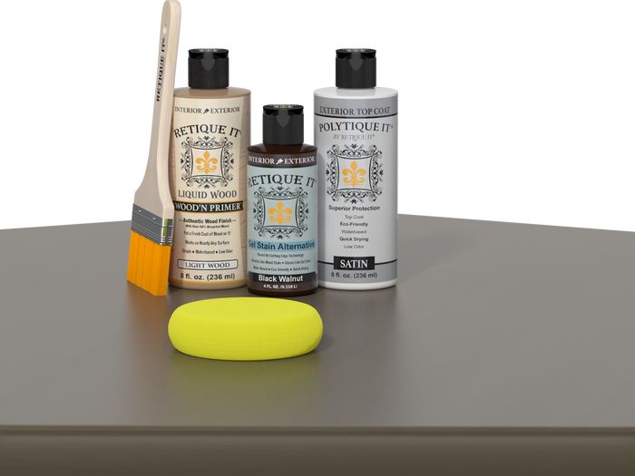 Retique It Black Walnut Kit with Satin Polytique It, Light Wood Wood'n Primer, Black Walnut Gel Stain Alternative, paintbrush, and yellow sponge on a tabletop.