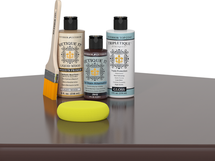 Retique It® Light Wood Wood’n Primer with Java Gel Stain Alternative, gloss topcoat, brush, and yellow sponge on a reflective tabletop.