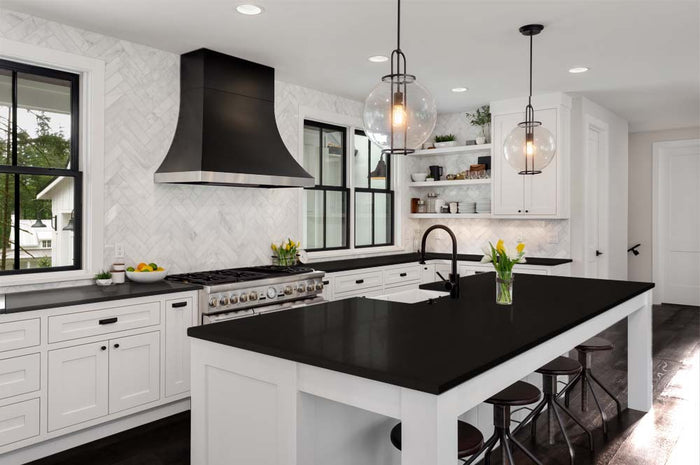 Retique It large black wood finish kit with smooth application on a kitchen countertop, showcasing its versatile wood refinishing features.