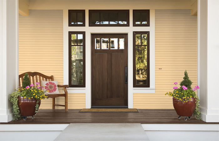Retique It Wood'n Kit in Black Walnut exterior top coat applied to a wooden front door with a smooth, polished finish.