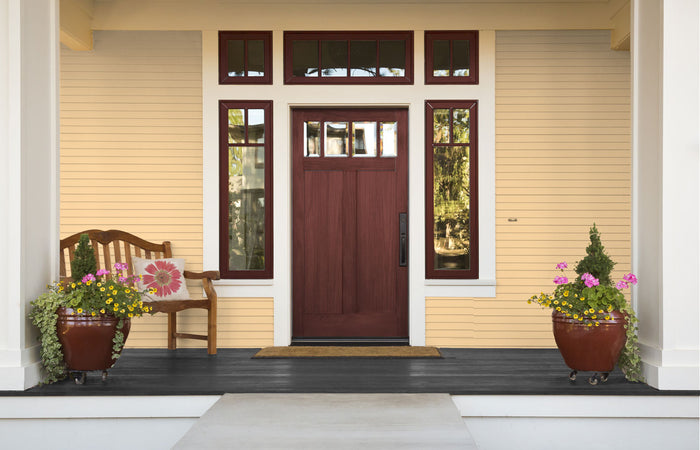 Retique It Wood'n Finish Kit in Red Mahogany exterior top coat applied to a wooden door surface.