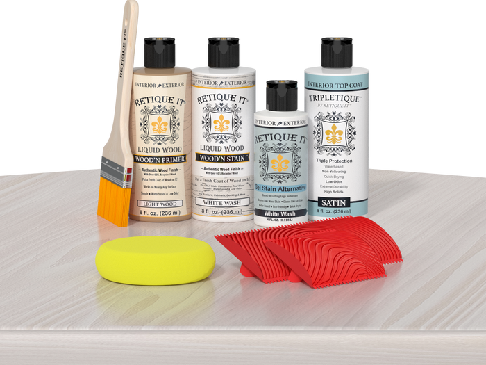Retique It® White Wash Wood'n Kit with Light Wood primer, White Wash stain, White Wash gel stain alternative, Satin Tripletique® Top Coat, brush, red graining tool, and yellow sponge.