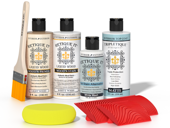 Retique It® White Wash Wood'n Kit with Light Wood primer, White Wash stain, White Wash gel stain alternative, Matte Tripletique® Top Coat, brush, red graining tool, and yellow sponge.