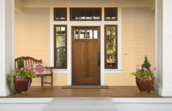 Front door with vintage cherry Wood'n Kit (Large) finish application showing natural wood grain and interior top coat details.