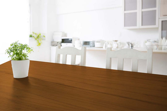 Retique It Wood'n Kit in Cedar, multi-purpose interior top coat applied on a wooden tabletop for a smooth finish.