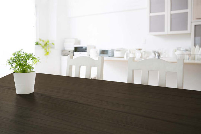 Retique It Wood'n Finish Kit in Charcoal for interior wood projects, showing a tabletop with the multi-purpose wood top coat applied.