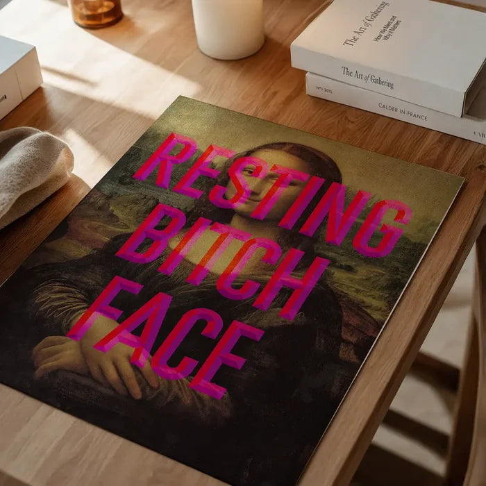 Resting Bitch Face Mona Lisa Print, quirky altered art print unframed on a home office desk