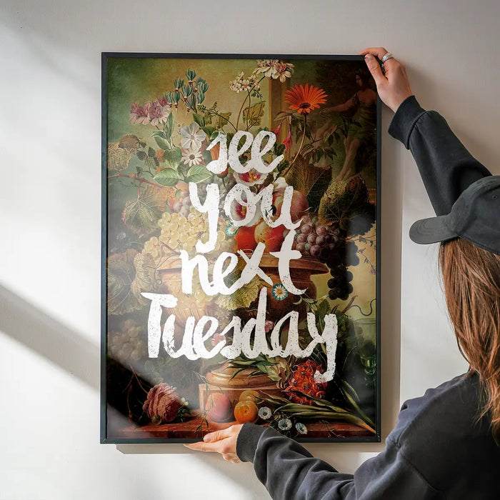See You Next Tuesday Altered Art Print being hung on a wall in a black frame