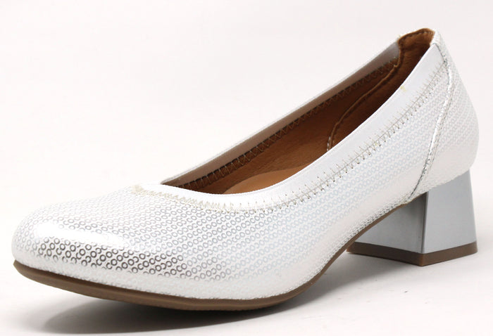 A silver metallic pump with a round toe and low block heel.