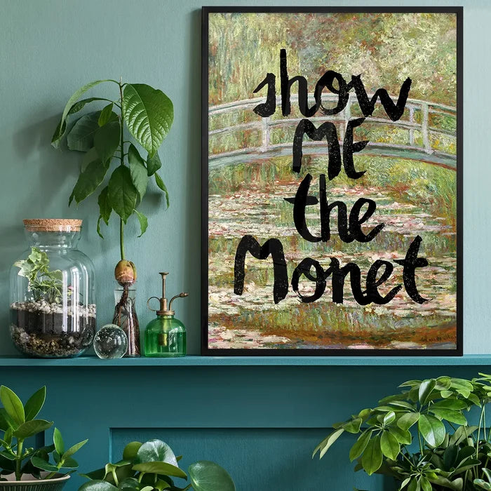 Show Me The Monet Altered Art Print, quirky altered art print black framed on a living room shelf