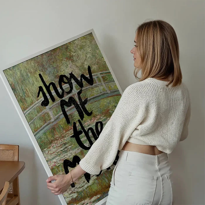 Show Me The Monet Altered Art Print held up against a living room wall