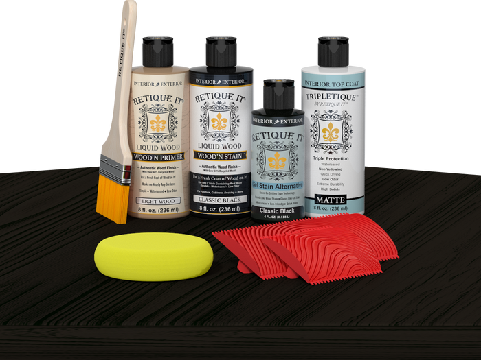 Retique It® Classic Black Wood'n Kit with Light Wood primer, Classic Black stain, Classic Black gel stain alternative, Matte Tripletique® Top Coat, brush, red graining tool, and yellow sponge.
