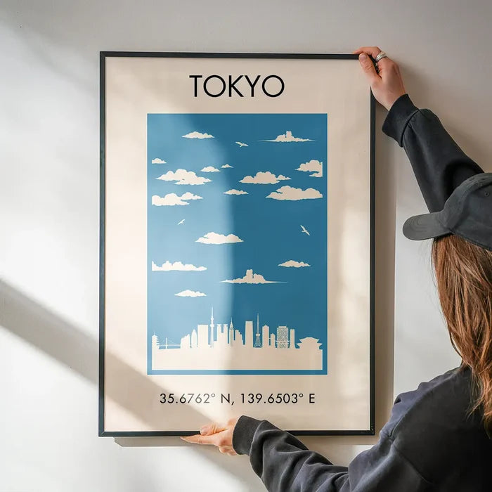 Tokyo Tourist Style Print being hung on a wall in a black frame
