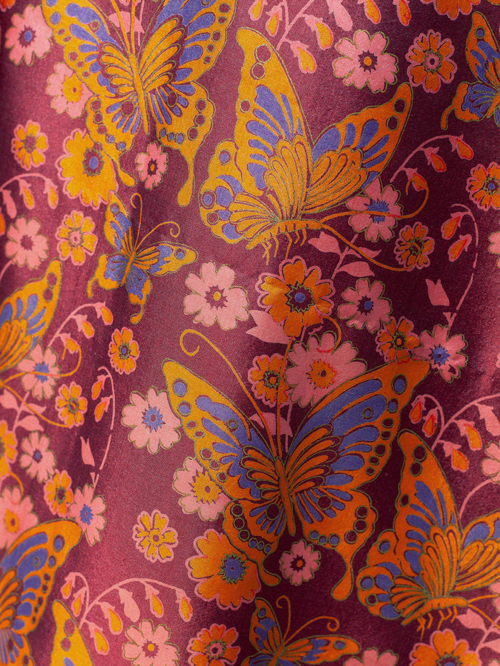 Calypso Silk Maxi Wrap Skirt featuring vibrant butterfly print on luxurious Thai silk fabric.