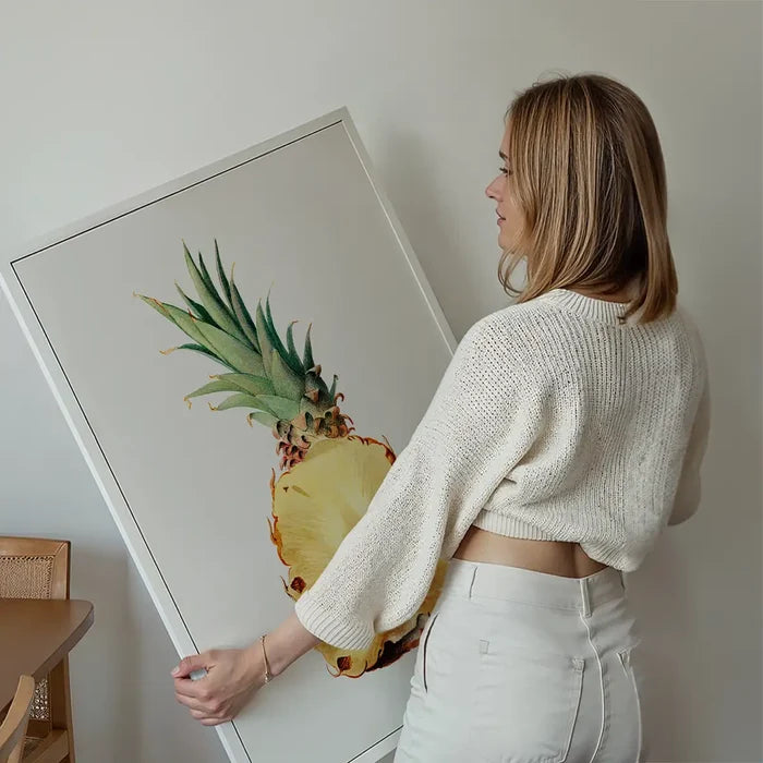 Vintage Half Pineapple Fruit Illustration Print held up against a living room wall