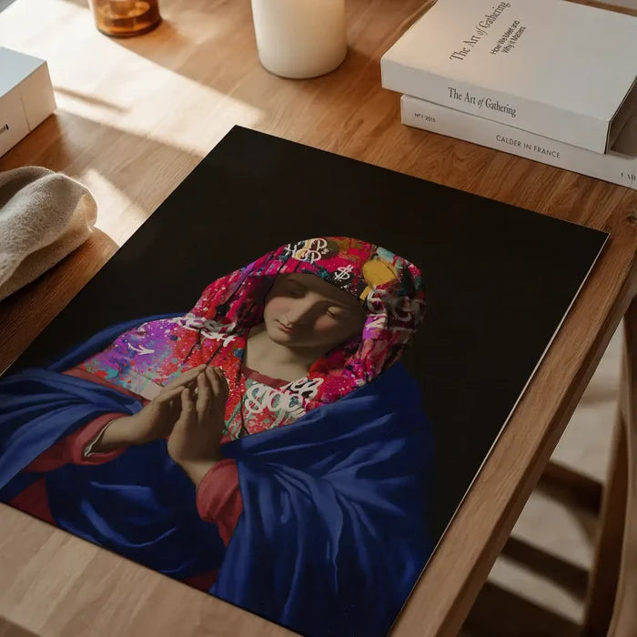 Virgin Mary Graffiti Hood Print, quirky altered art print unframed on a home office desk