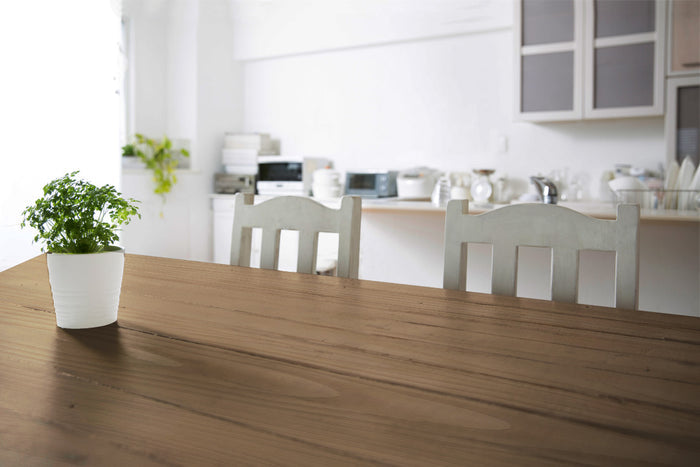 Rustic tabletop with weathered barn wood finish, showcasing Retique It wood finishing kit for a vintage, distressed look.