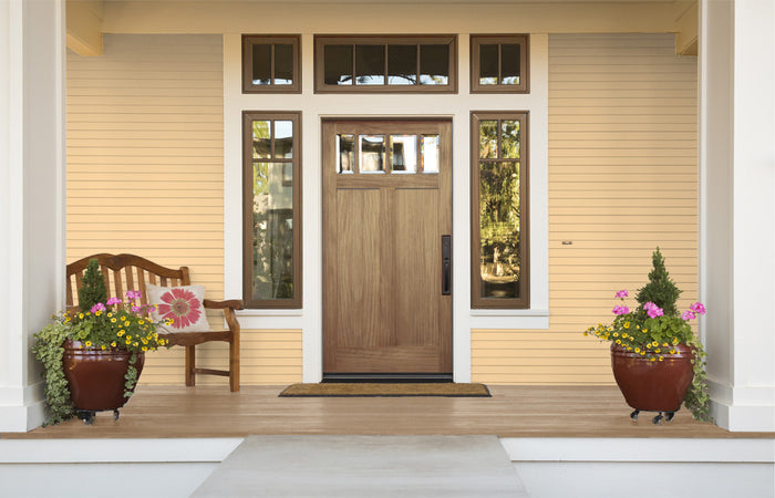 Retique It weathered finish kit in barn wood style applied to a front door, showcasing rustic, aged wood appearance and texture.