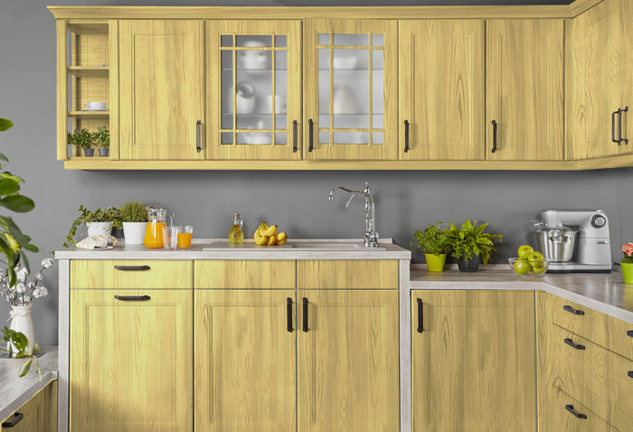 Retique It Weathered Finish Kit in Canary Yellow applied to kitchen cabinets, showcasing a rustic wood finish with a weathered look.