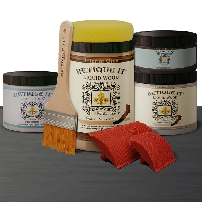 Retique It weathered finish kit in charcoal for wood, showing color swatches and application tools in a natural setting.