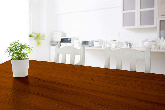 Retique It Weathered Finish Kit in Cherry applied to a wooden tabletop, showcasing a rustic, aged wood finish with natural grain.