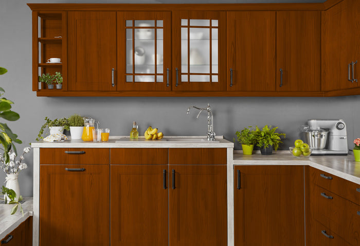 Retique It weathered cherry wood finish kit applied to kitchen cabinets showing a rustic, aged wood look.